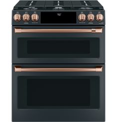 two black and copper ovens side by side with the top one showing its burners