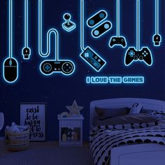 a bedroom with neon lights and video game controllers on the wall