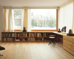 a living room filled with furniture and a large window covered in frosted windowsills