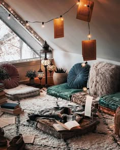 a living room filled with lots of furniture and books on top of a white rug