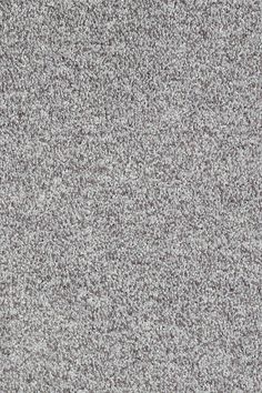 a gray carpet with small speckles on it