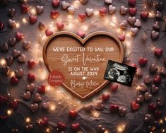 a heart shaped wooden plaque with the words we are excited to say our god valentine is on the way august 22, 2012