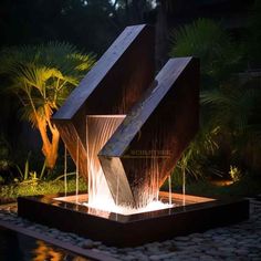 a water fountain in the middle of a garden