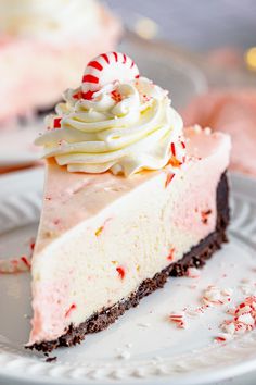 a slice of peppermint ice cream pie on a plate with candy canes