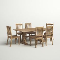 a wooden table with six chairs around it