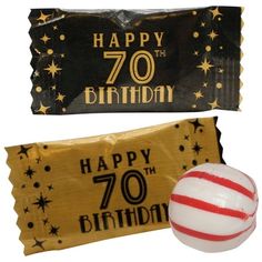 a birthday candy bar with a happy 70th birthday sign next to it and a striped ball