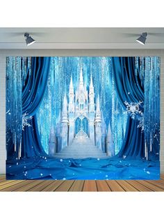 an image of a frozen castle in the snow with blue drapes on it's walls