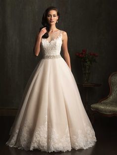 a woman in a white wedding dress posing for the camera