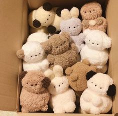 a box filled with lots of stuffed animals