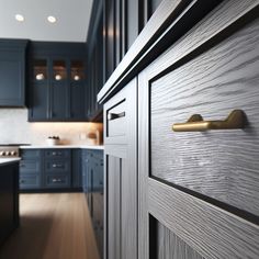 an open door leading to a kitchen with blue cabinets and counter tops in the background