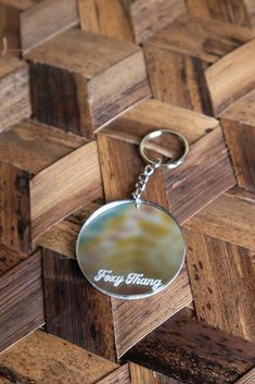 a keychain with the words happy birthday on it