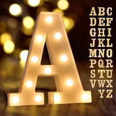 PRICES MAY VARY. Specification: Light up letters?size approx (W x H x D): 3.03" x 8.54" x 1.69" Made environmental ABS + PP material, requires no outlet, uses 2AA batteries(NOT included). Hanging holes and On/ Off switch on the back. Marquee letters with lights?can be displayed stand alone or hang on the wall. Easy to Use: Marquee letters with lights?(26 Alphabet letters and & symbols) provide endless possibilities of creating message. Spell out any name or phrase with these fabulous light up al White Led Letter Lights, Initials Lights Wedding, Christmas Lights With Names, Wall Letter Lights, Lights For Signs, Chanel Led Light, Led Lights Bedroom Letters, Metal Letter Lights, L.e.d. Lights