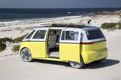 a yellow van is parked on the beach