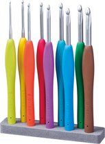 six different colored toothbrushes are lined up in a row on a gray holder