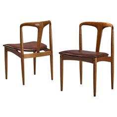 two wooden chairs side by side on a white background, one with a brown leather seat and the other without