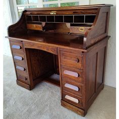 an old fashioned wooden desk with drawers