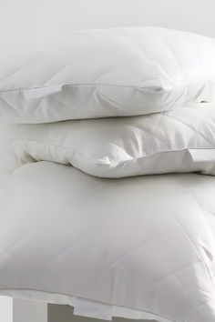 two pillows stacked on top of each other