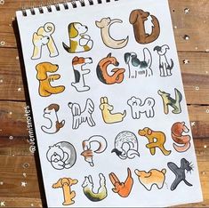 a notebook with the letters drawn on it