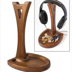 a wooden stand with headphones on it and some coins in the holder next to it