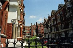 an image of a city street with buildings in the background