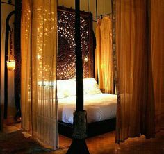 an image of a bed with lights in the background and text that reads, with this approach, you'll create four canopies around the corners of the bed it takes a little longer to