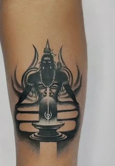 a black and white tattoo on the leg of a person