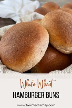 three whole wheat hamburger buns in a basket with text overlay that reads, whole wheat hamburger buns