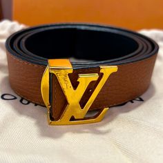 Authentic. In Good Condition. Only Defect Is The Scratch On The Lv. Leather On Actual Belt Is In New Condition. Only Wore Two Times. It’s Reversible With Brown And Black. Has Tag, Dust Bag, And Box. Possibly Still Have Lv Bag As Well. Still Have Receipts Lv Daily Multi Pocket Belt, Louise Vuitton Belt, She's Gotta Have It, Louis Vuitton Belt, Reversible Belt, Louis Vuitton Accessories, Brown Leather Belt, Louis Vuitton Shoulder Bag, Lv Bag