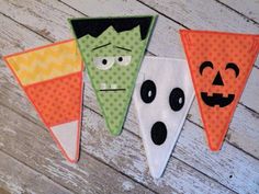 three halloween buntings with faces on them