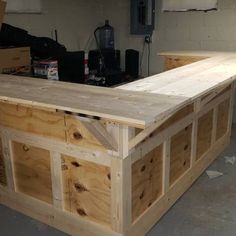 an unfinished workbench is being built in a garage