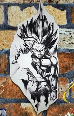 a drawing of the character gohan is hanging on a brick wall next to some other items