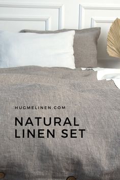 the natural linen set is on display in front of a white headboard and pillows