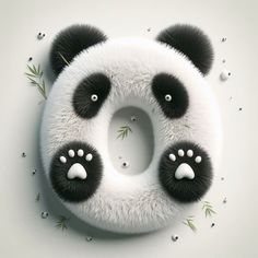 a panda bear with black and white fur on it's face, surrounded by bamboo leaves