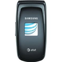 the samsung cell phone is black and has an at & t logo on its screen