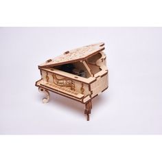 an old fashioned wooden music box sitting on top of a table