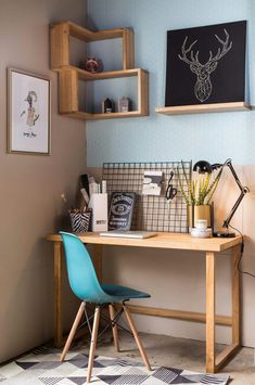 a wooden desk topped with a blue chair