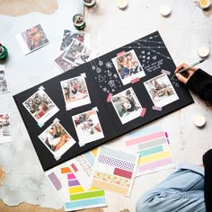 a table with many different pictures and candles on it, including one that has been cut out