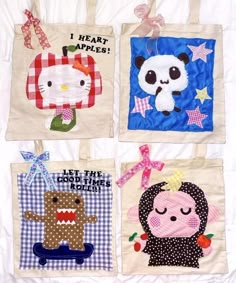 four tote bags with different designs on them