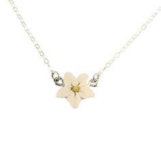 A minimalist style is featured with this tiny jasmine necklace for an everyday simple flower necklace. Choose your chain length as a choker necklace or longer.  The tiny jasmine measures approximately 12mm and is available in many colors and a choice of silver-plated, gold-plated, antique brass, 925 sterling silver or 14k gold filled components.  Perfect for any occasion, formal or everyday wear. -Original hand sculpted polymer clay flower, durable, water-resistant, no molds, no paint- -Flower size : approximately 12mm -Metal Components : Choose silver-plated, gold-plated, antique brass, 925 sterling silver or gold filled -Length : Choose 16 or 18 inch chain Petite 1cm matching studs also available! View matching collection at:  https://www.etsy.com/shop/strandedtreasures/search?search_que Jasmine Jewelry, Jasmine Necklace, Tiny White Flowers, White Jasmine, Gold Bond, Clay Flower, Simple Flower, Polymer Clay Flowers, Necklace White