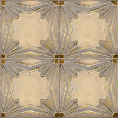 an artistic tile design in gold and silver