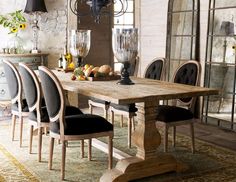 a dining room table with chairs around it