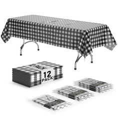 the table cloth is black and white checkerboard with numbers on it, along with four packs of napkins