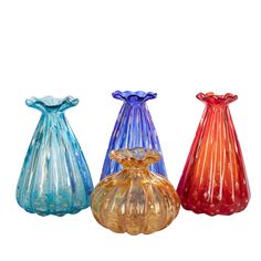 three glass vases sitting next to each other