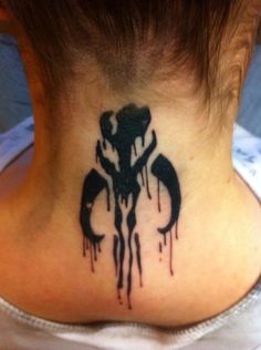 a woman with a tattoo on her neck that has a star wars symbol painted on it