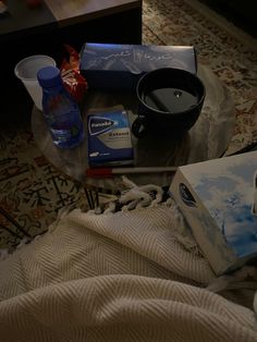 an assortment of items sitting on top of a glass table