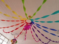 colorful streamers are hanging from the ceiling