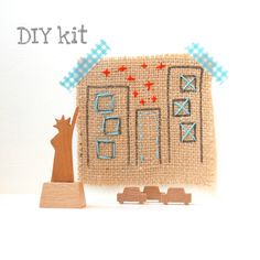 a small wooden block with a piece of wood next to it and the words diy kit written on it