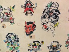 various tattoo stickers on the side of a wall