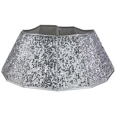 a silver sequinned lamp shade on a white background