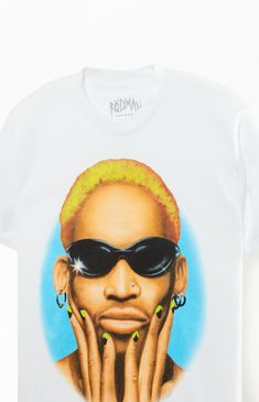 a white t - shirt with an image of a woman wearing sunglasses